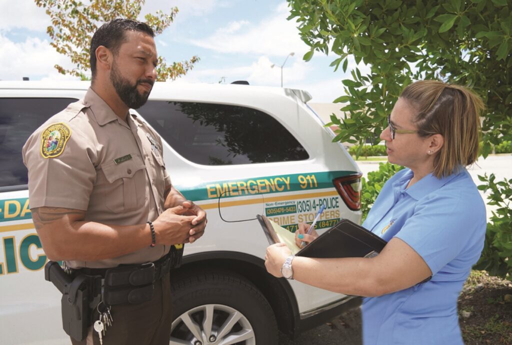 woman speaking with officer